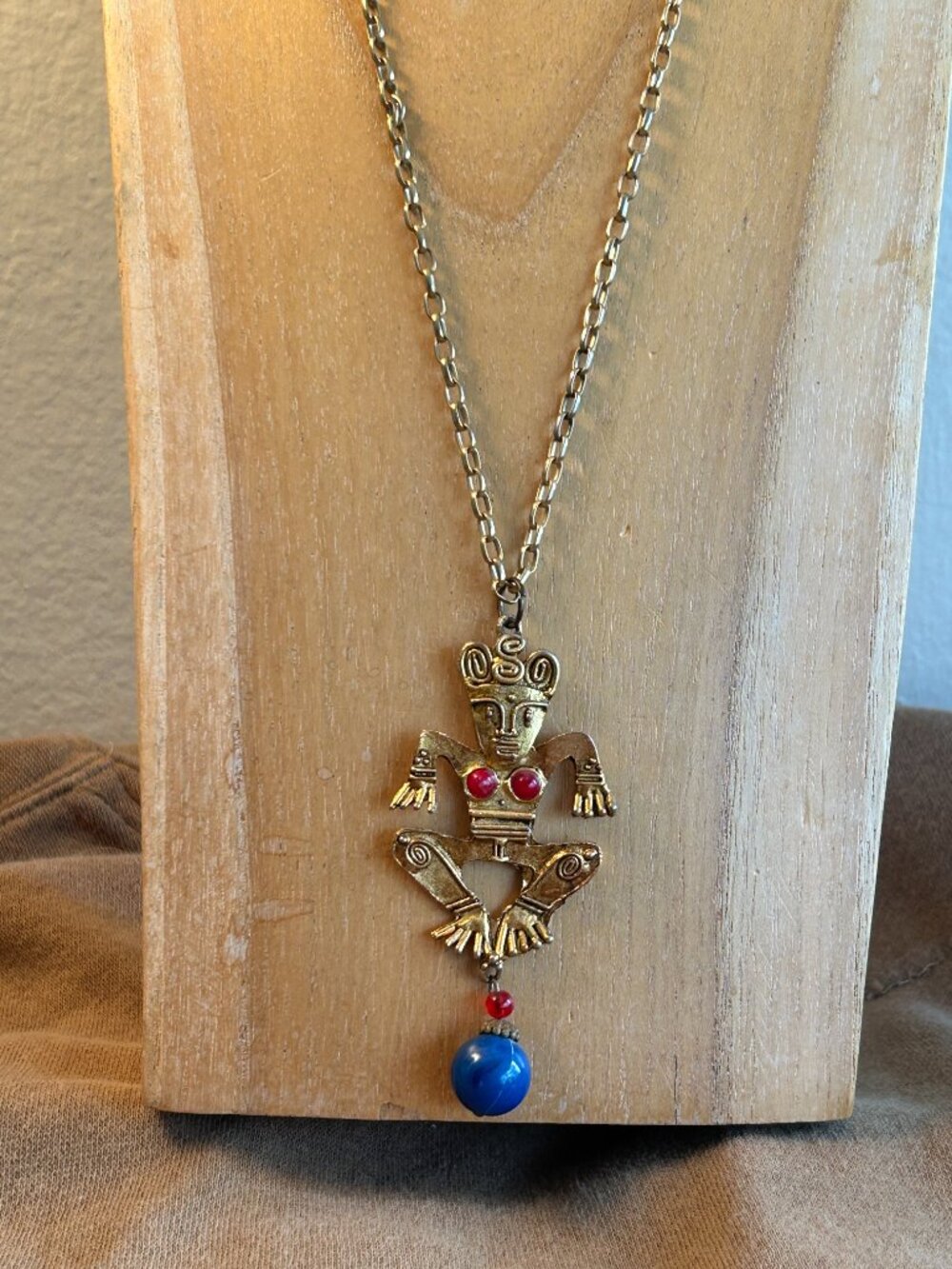 gold tone Aztec style pendant